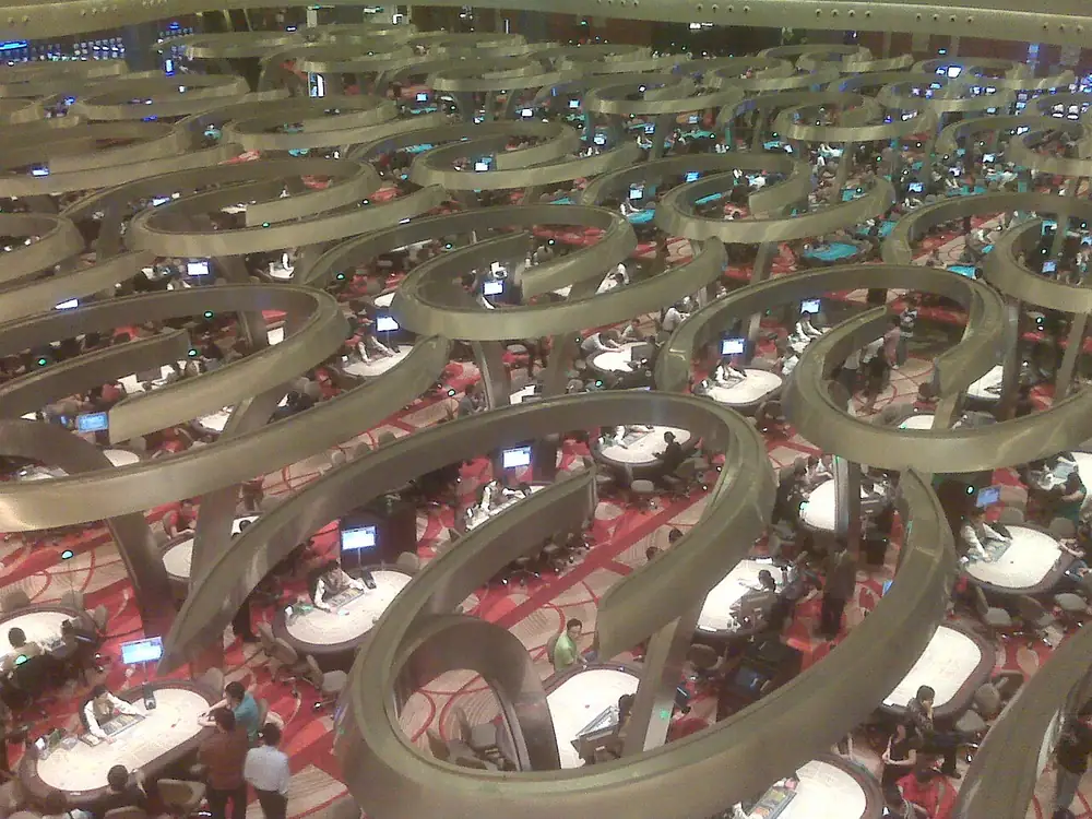 Baccarat tables on a casino floor - how to play online casino for real money