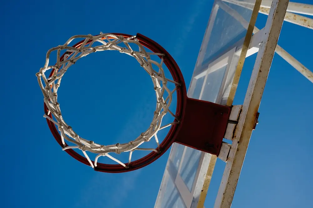 nba playoffs betting tips nigeria - basketball hoop against blue sky